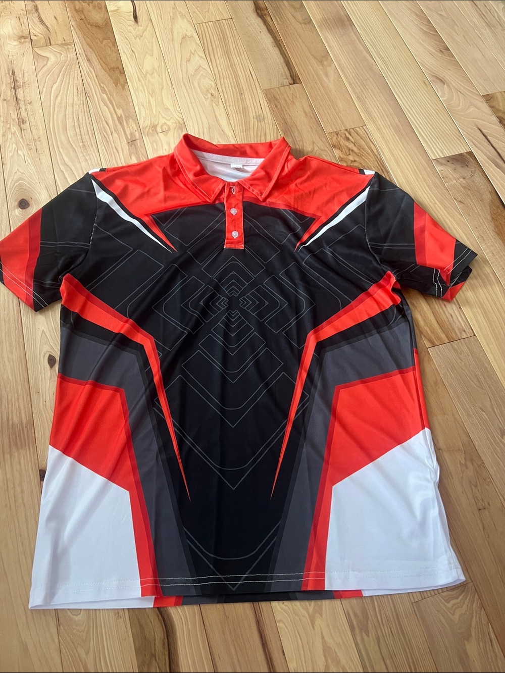 NWOT Orange and Black Geometric Polo Shirt
